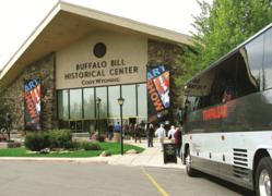 Tour bus unloads passengers.